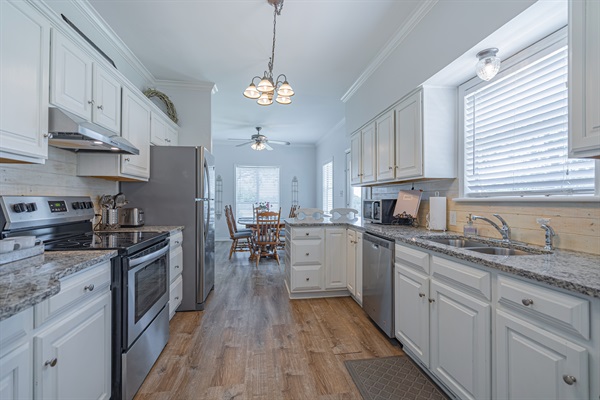 Farmhouse kitchen - stocked with dishes, utensils, and basic cookware