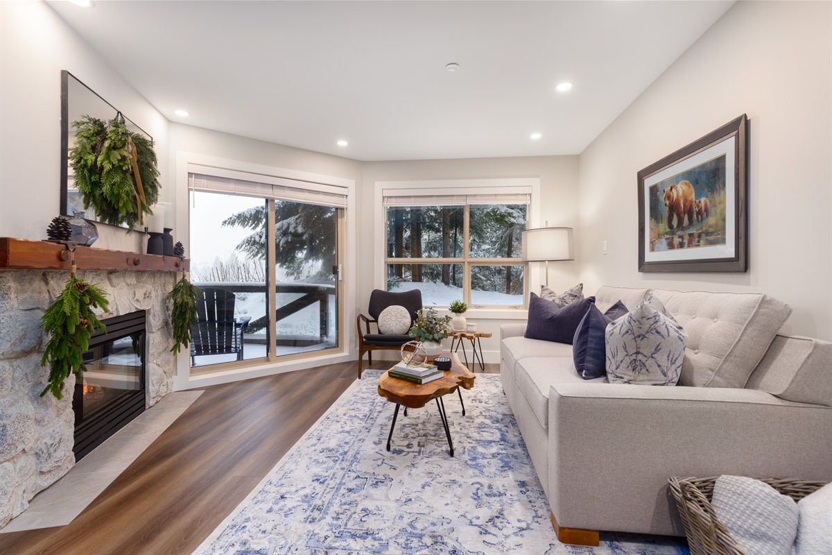 View of the evergreen treeline from living room.