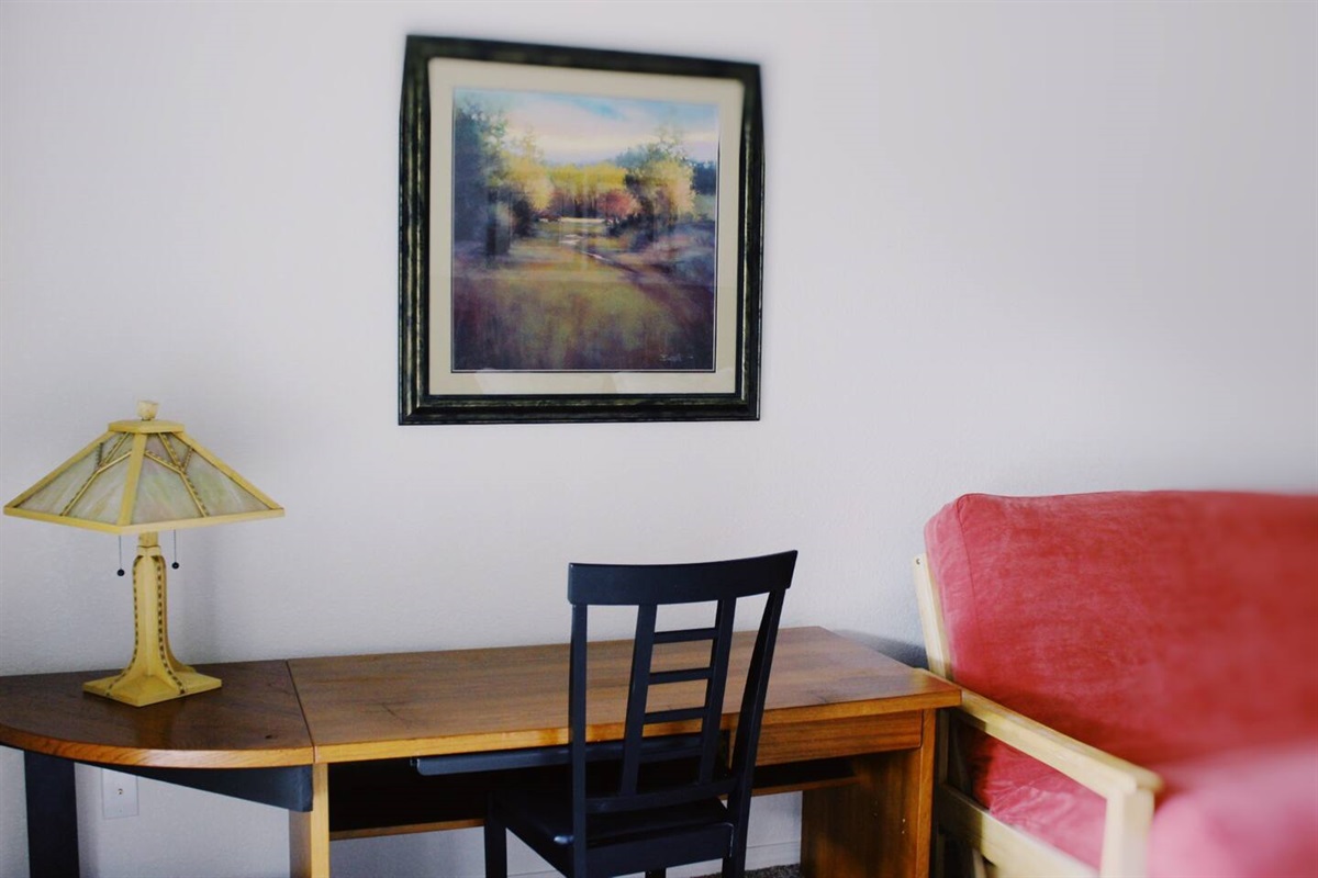 There is a desk and dedicated workspace in this bedroom for those who want a place to set up.