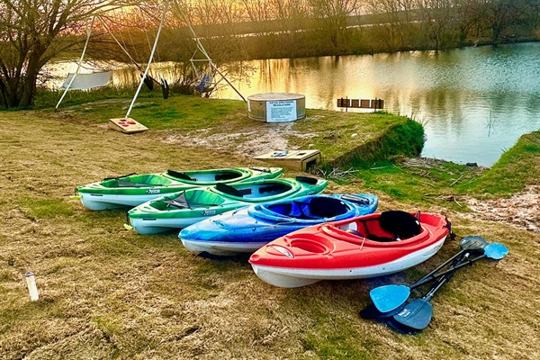 Kayaks ready for sunset adventures on the lake.