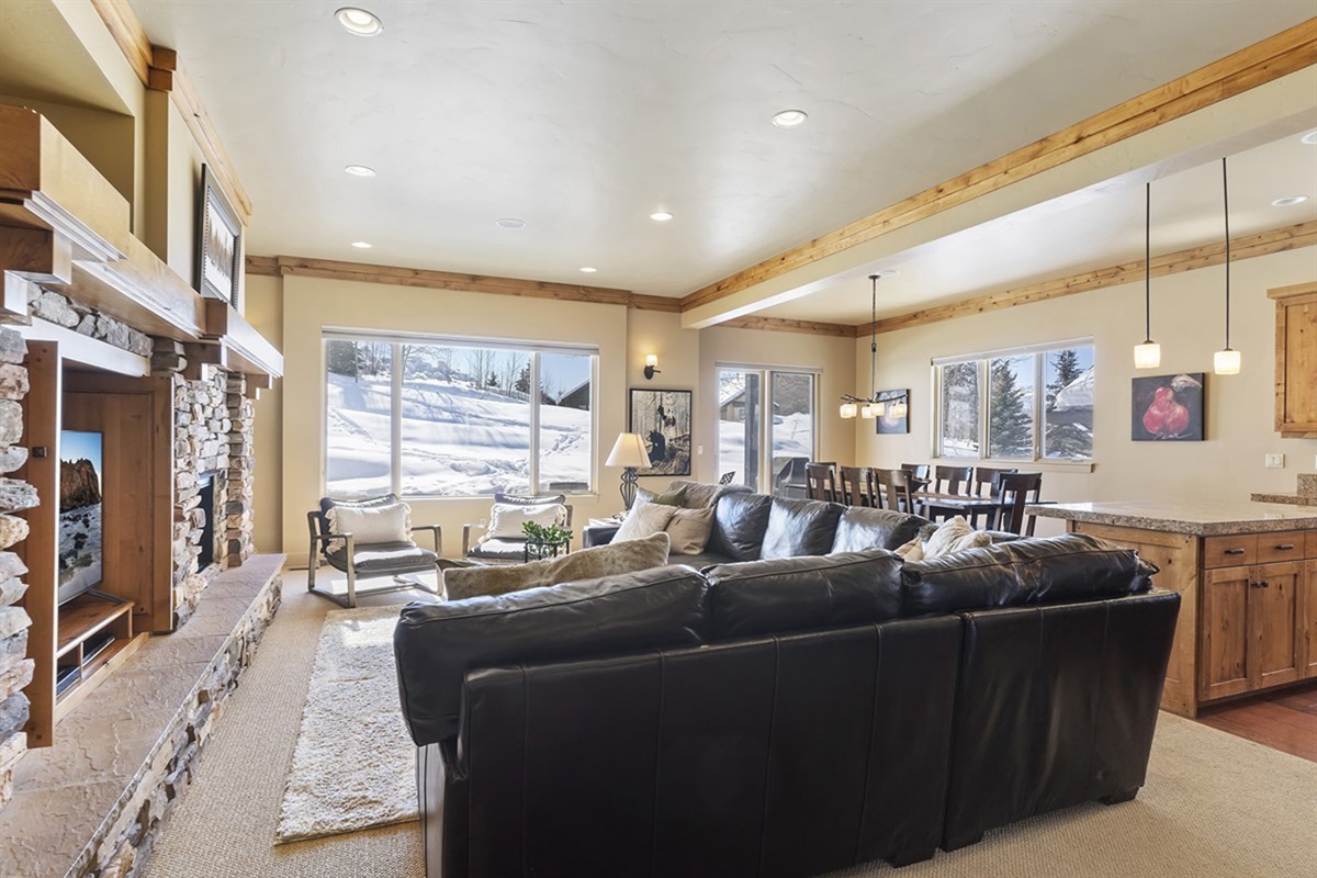 Settle in with mountain views and a warm fire—this inviting space was made for relaxing after a full day out.