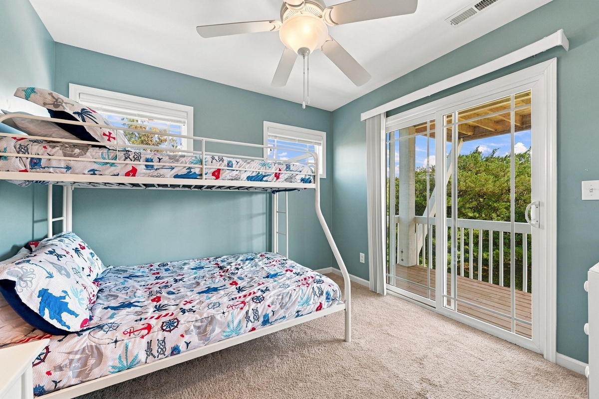 Bunk up for beachside fun! This bunk room is the perfect retreat for kids or extra guests, offering a fun and comfortable space