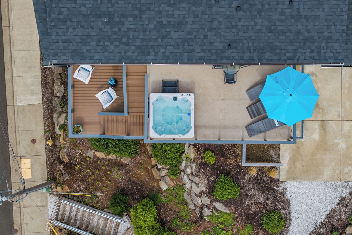 One of the home’s multiple decks includes a private hot tub, lounge seating, and room to entertain. It’s the perfect setting for morning coffee, or sunset soaking, or starry-night conversations.