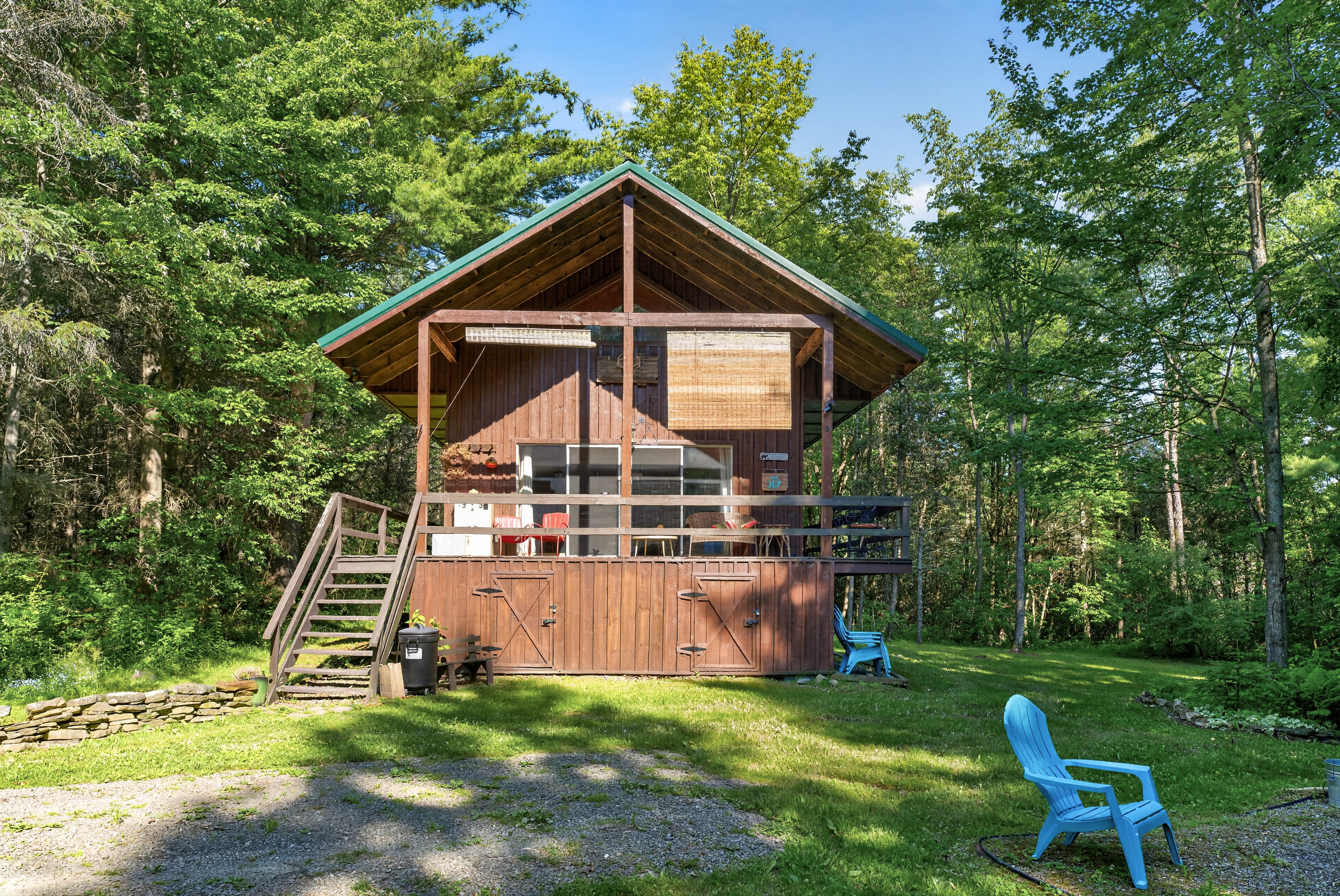 Wood cabin surrounded by mature trees
