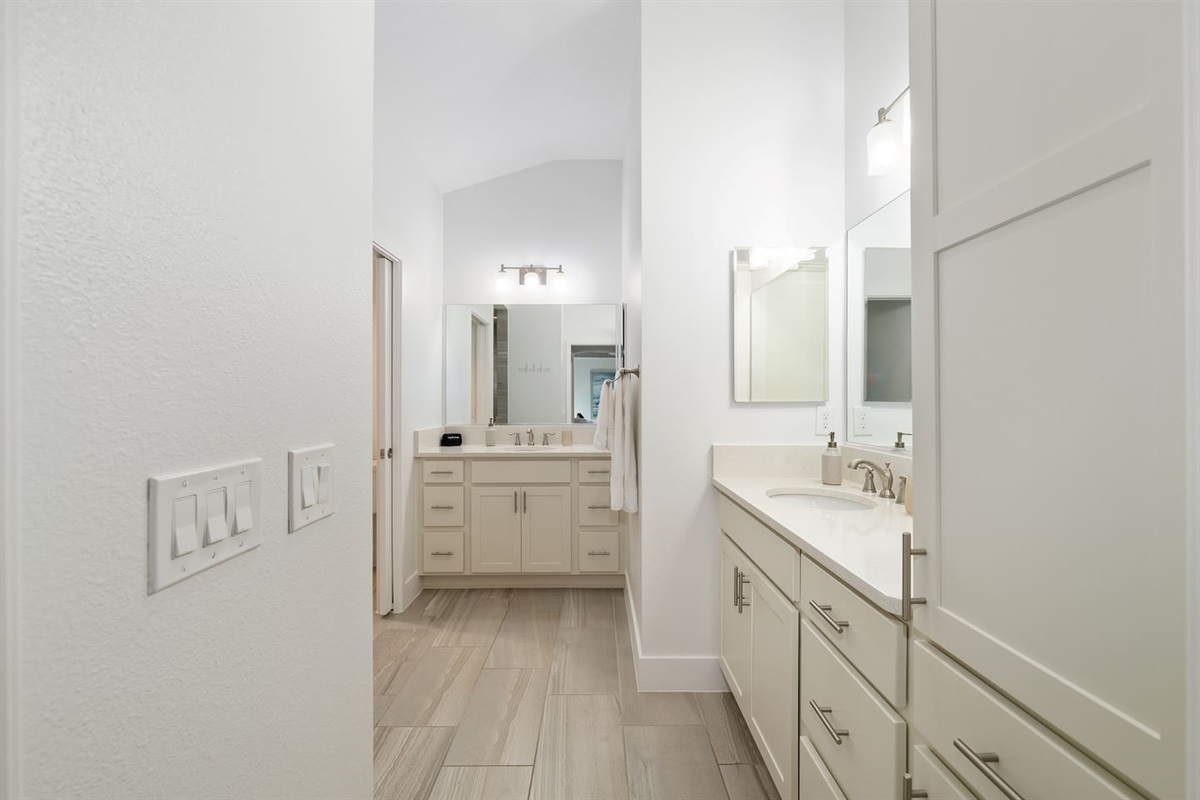 Bright bathroom with dual vanities