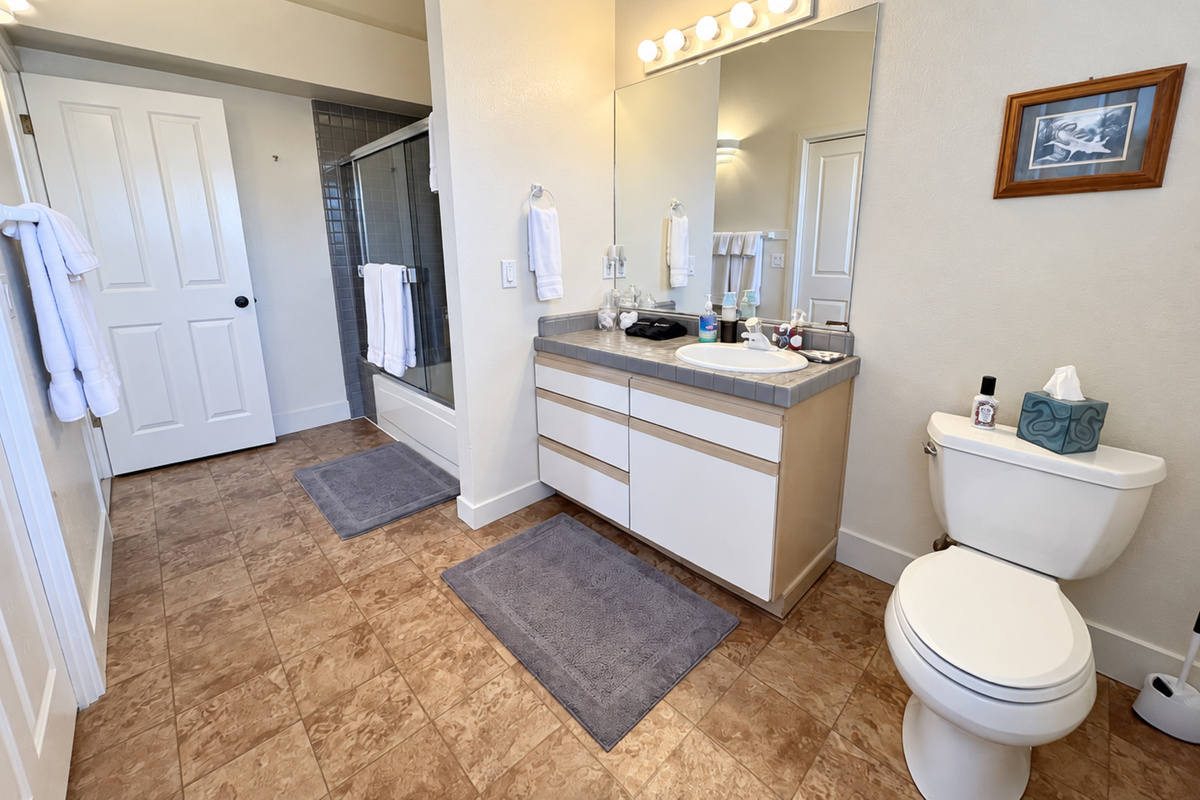 Guest Bath with Tub/shower combo. Attached Washer/dryer in closeted area.