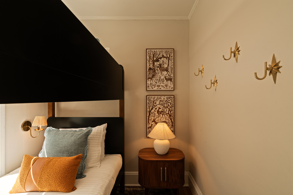Small space, great details. Thoughtful touches make this cozy bunk room feel special while giving two guests their own comfortable twin beds.