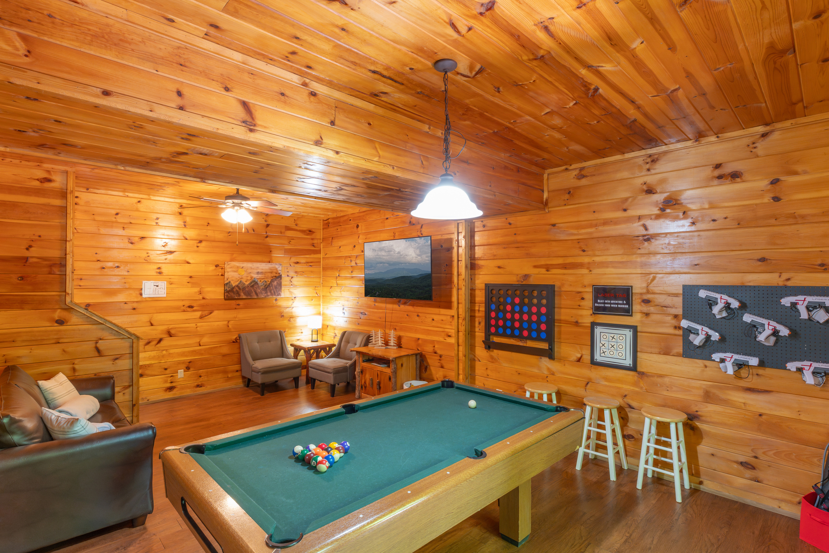With a barrel arcade, pool table, wall games, board games and a spacious family room, you'll find your whole group enjoying time in the game room. We even added Laser Tag!