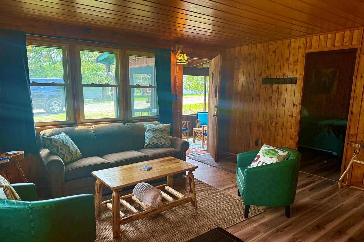 Living room opens to a beautuful screened porch area.