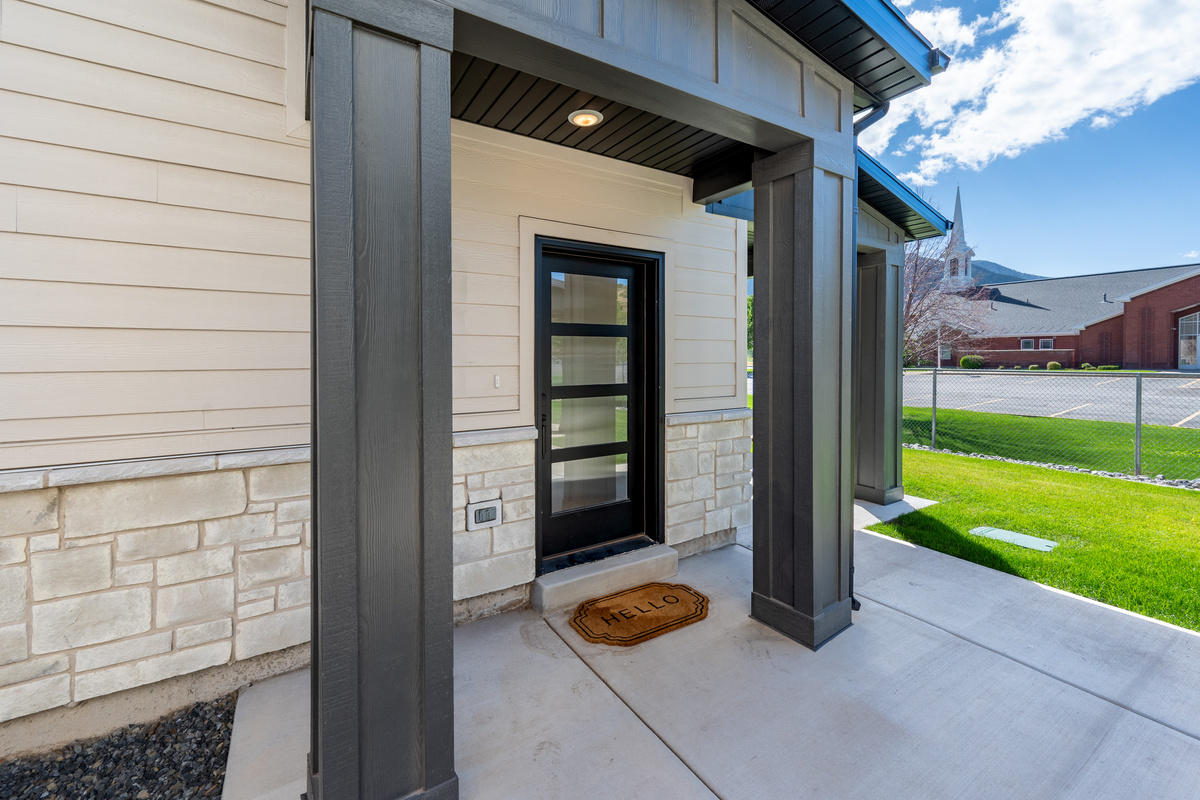 Entrance to the home with the Hot tub around the corner