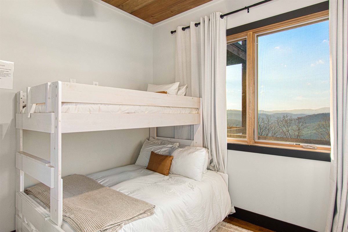 Twin over full bunk with a twin trundle bed.