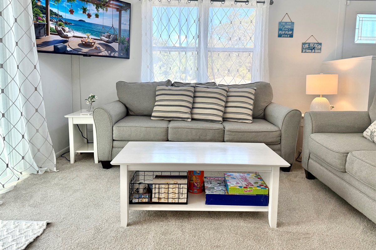 This living area combines modern furnishings with beachy charm, offering a serene retreat after a day of exploring Crystal Beach.