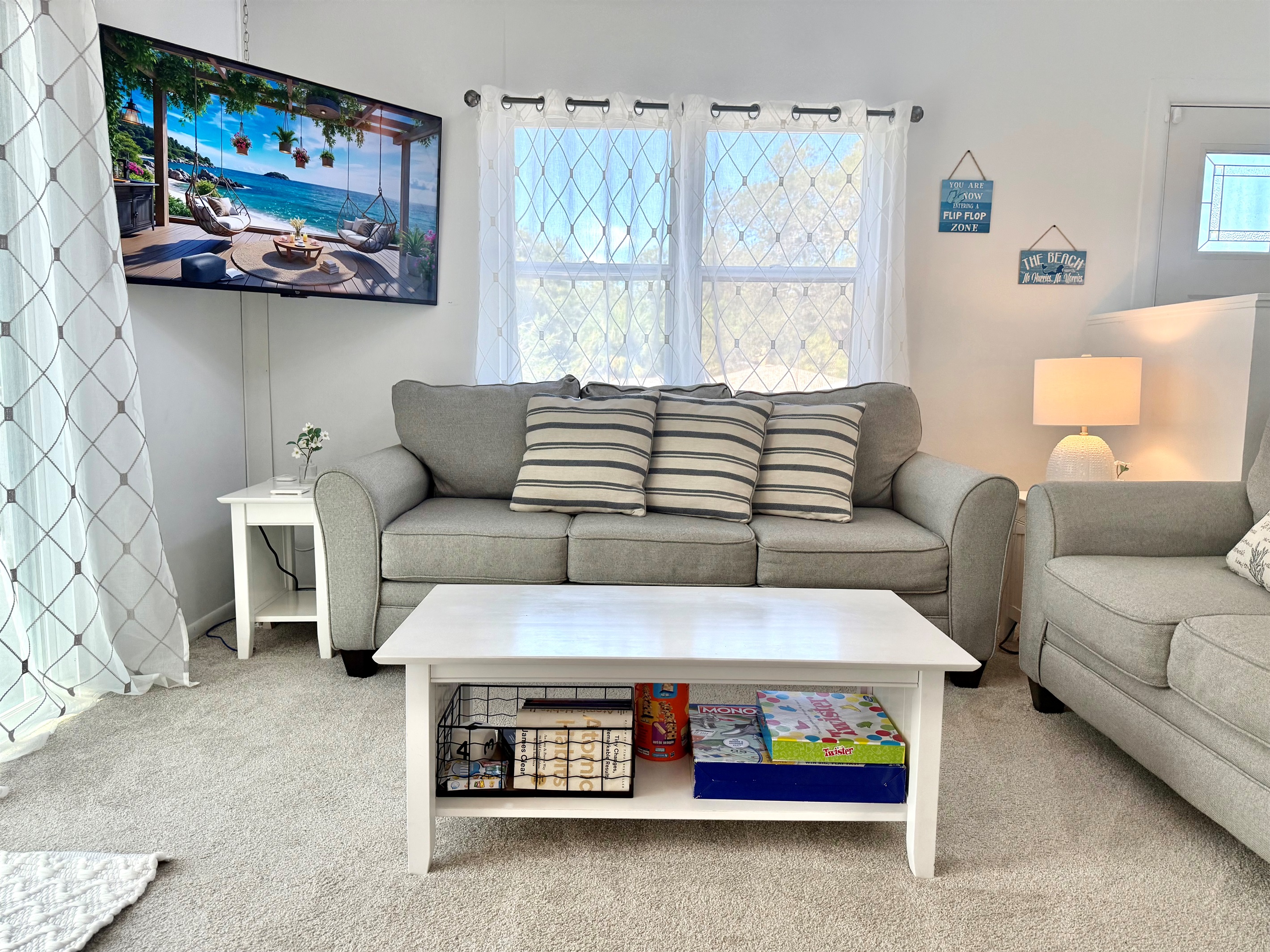 This living area combines modern furnishings with beachy charm, offering a serene retreat after a day of exploring Crystal Beach.