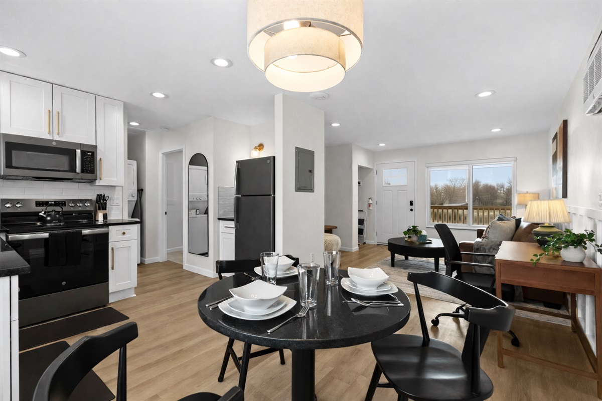 Stylish open-concept layout with modern kitchen, dining area, and cozy living space—ideal for gathering, cooking, and unwinding with ease.
