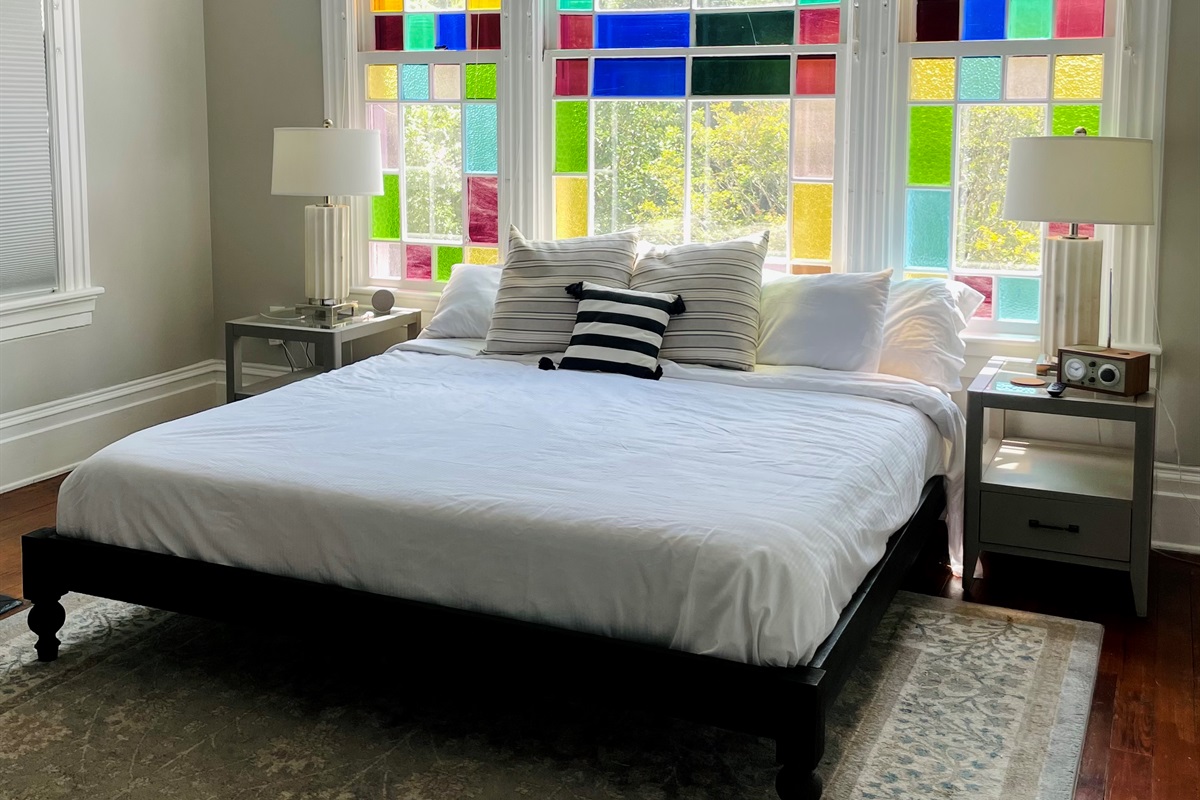 Primary bedroom with ensuite bath is truly a gem.  Stretch out on the king sized bed, enjoying the Savannah sunshine shining through the stain glass windows.  Located on one of the quieter blo