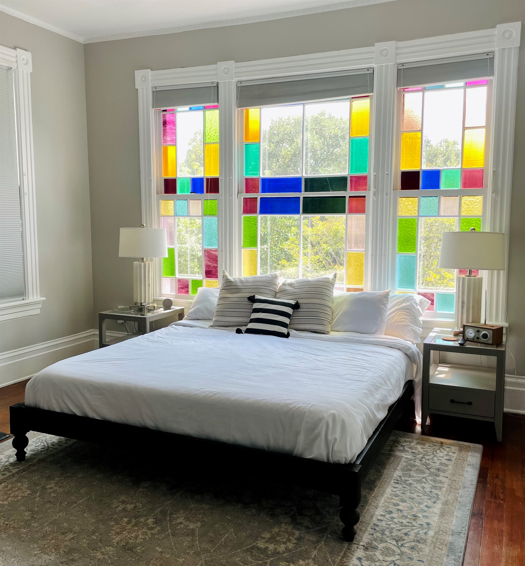 Primary bedroom with ensuite bath is truly a gem.  Stretch out on the king sized bed, enjoying the Savannah sunshine shining through the stain glass windows.  Located on one of the quieter blo