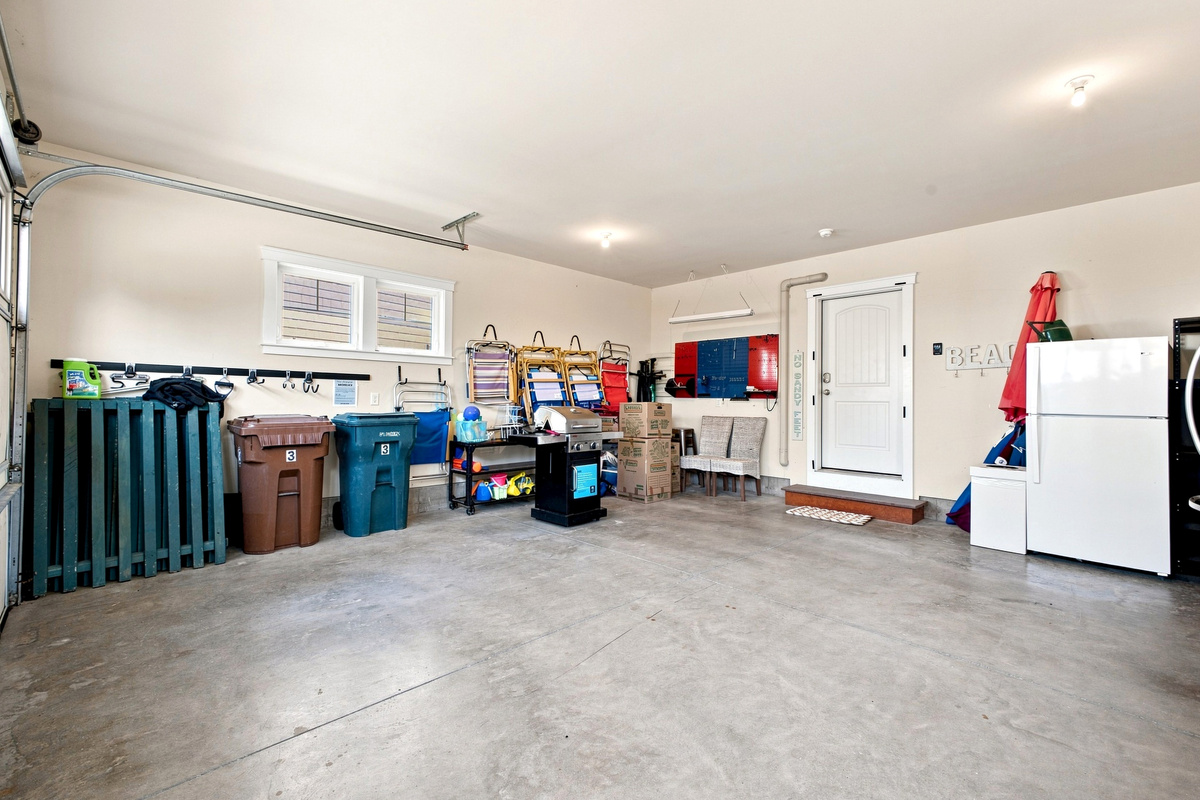 A spacious garage offers convenient storage for beach gear and vacation essentials during your stay.