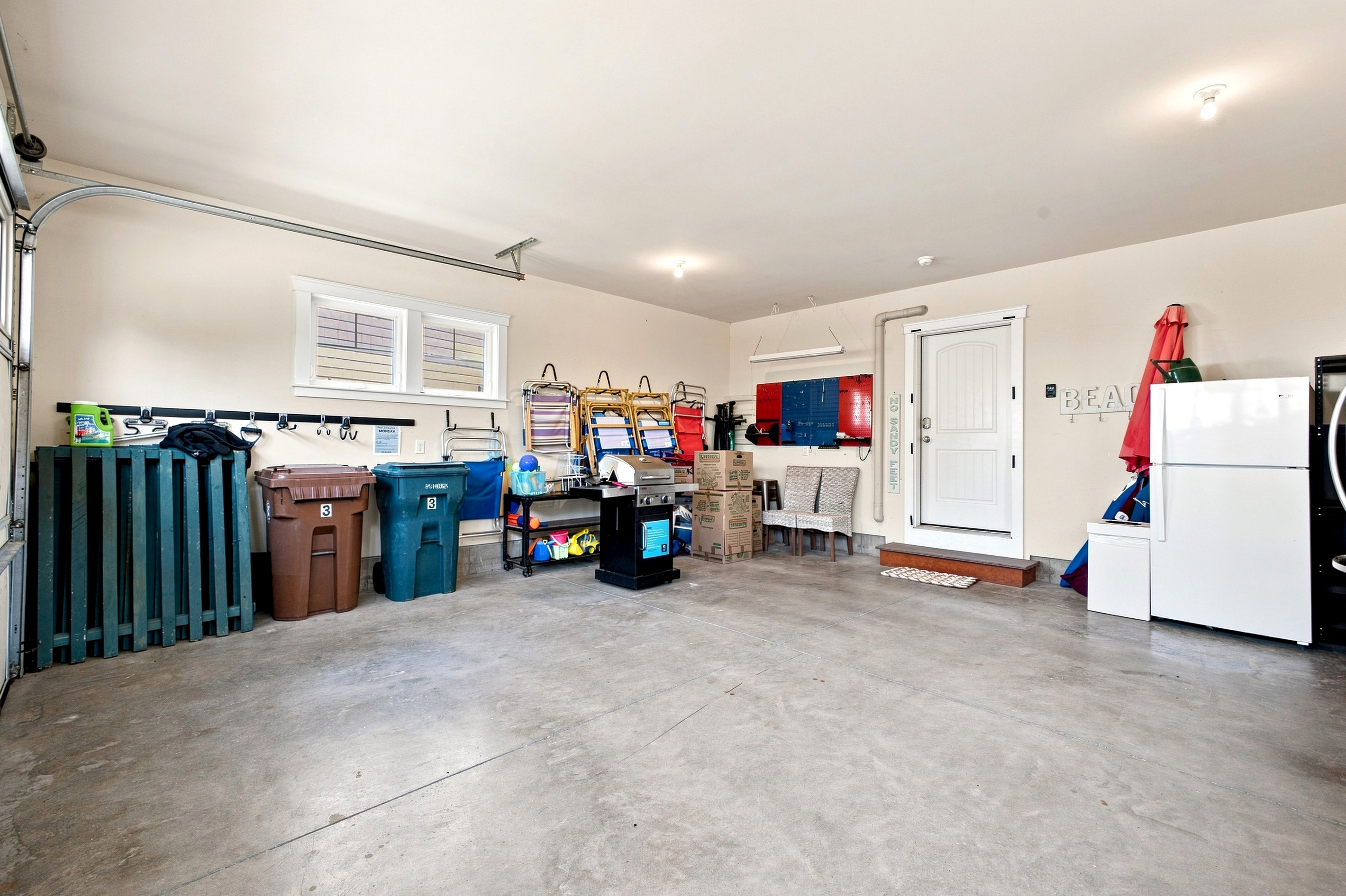 A spacious garage offers convenient storage for beach gear and vacation essentials during your stay.