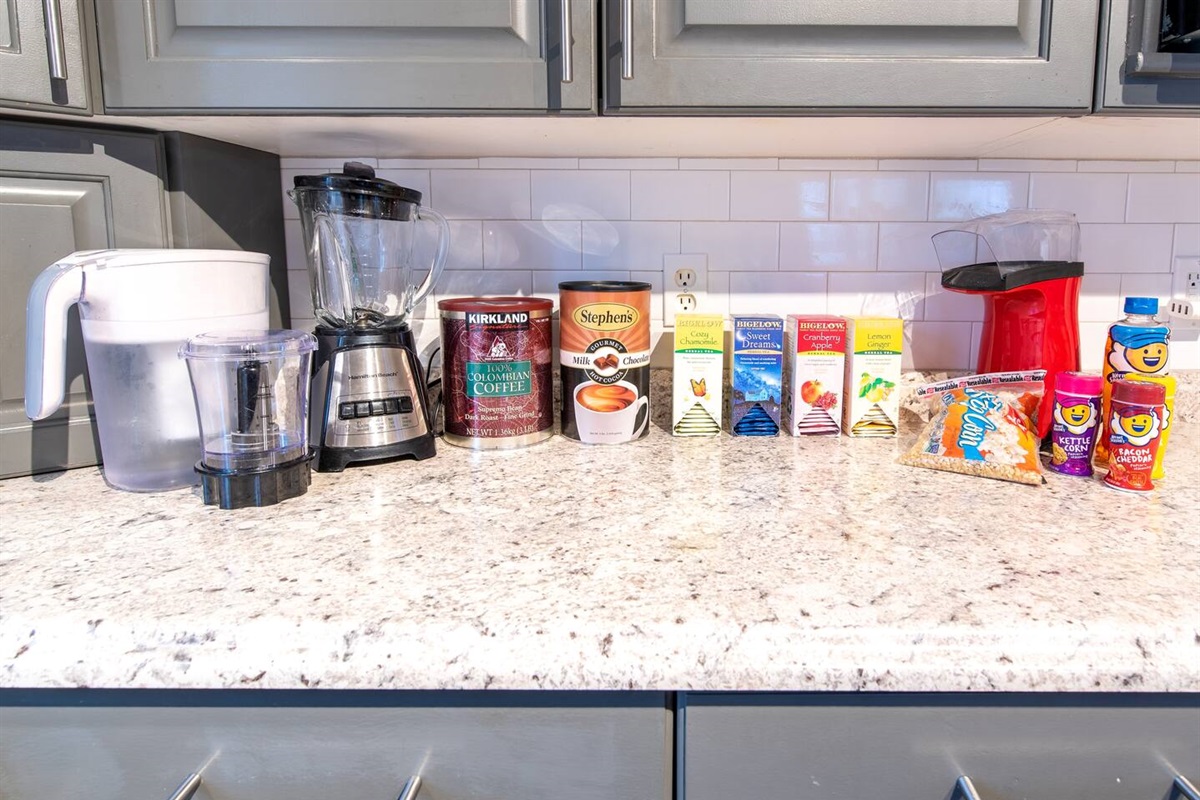 Coffee maker, blender, coffee, hot chocolate, popcorn machine, and a variety of teas.