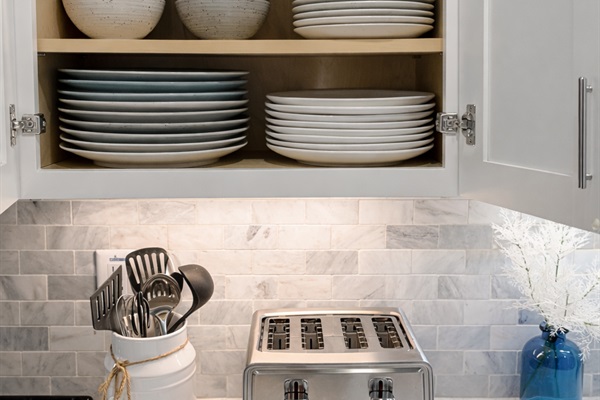 Kitchen essentials and dishware to serve 10 or more.