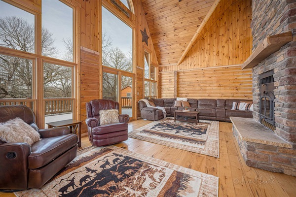 Living room with access to the huge back porch and pool. Flows between entryway and kitchen.