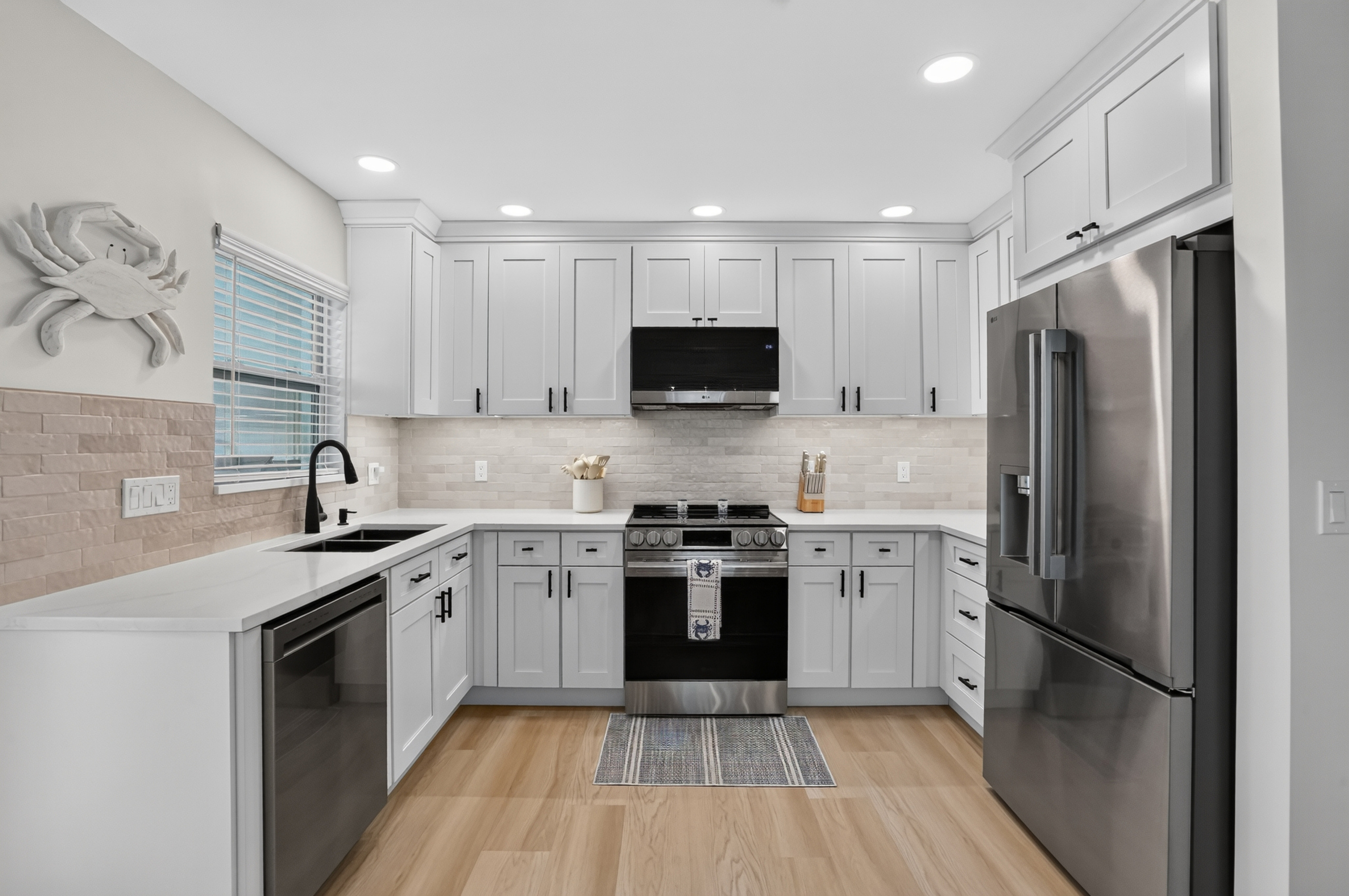 The beautifully remodeled kitchen is fully equipped for everything from morning coffee to dinner at home.
