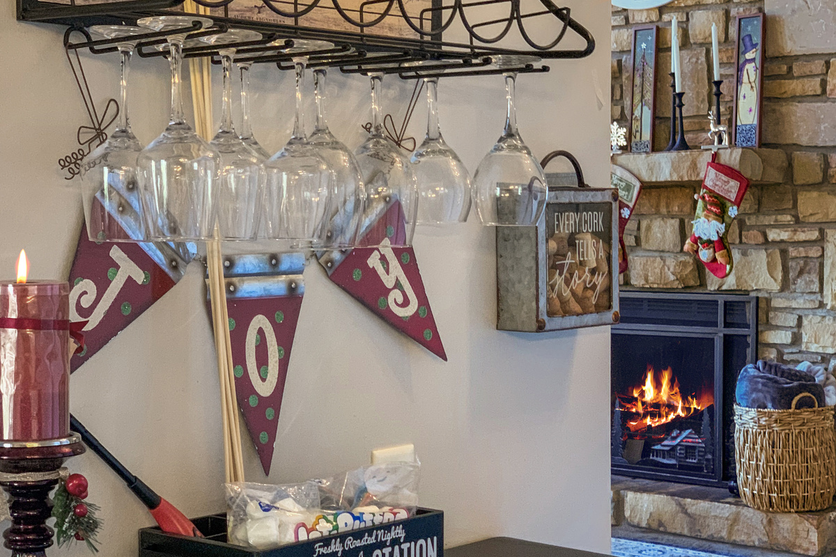 Festive bar area with glassware and a fun s’mores station!
