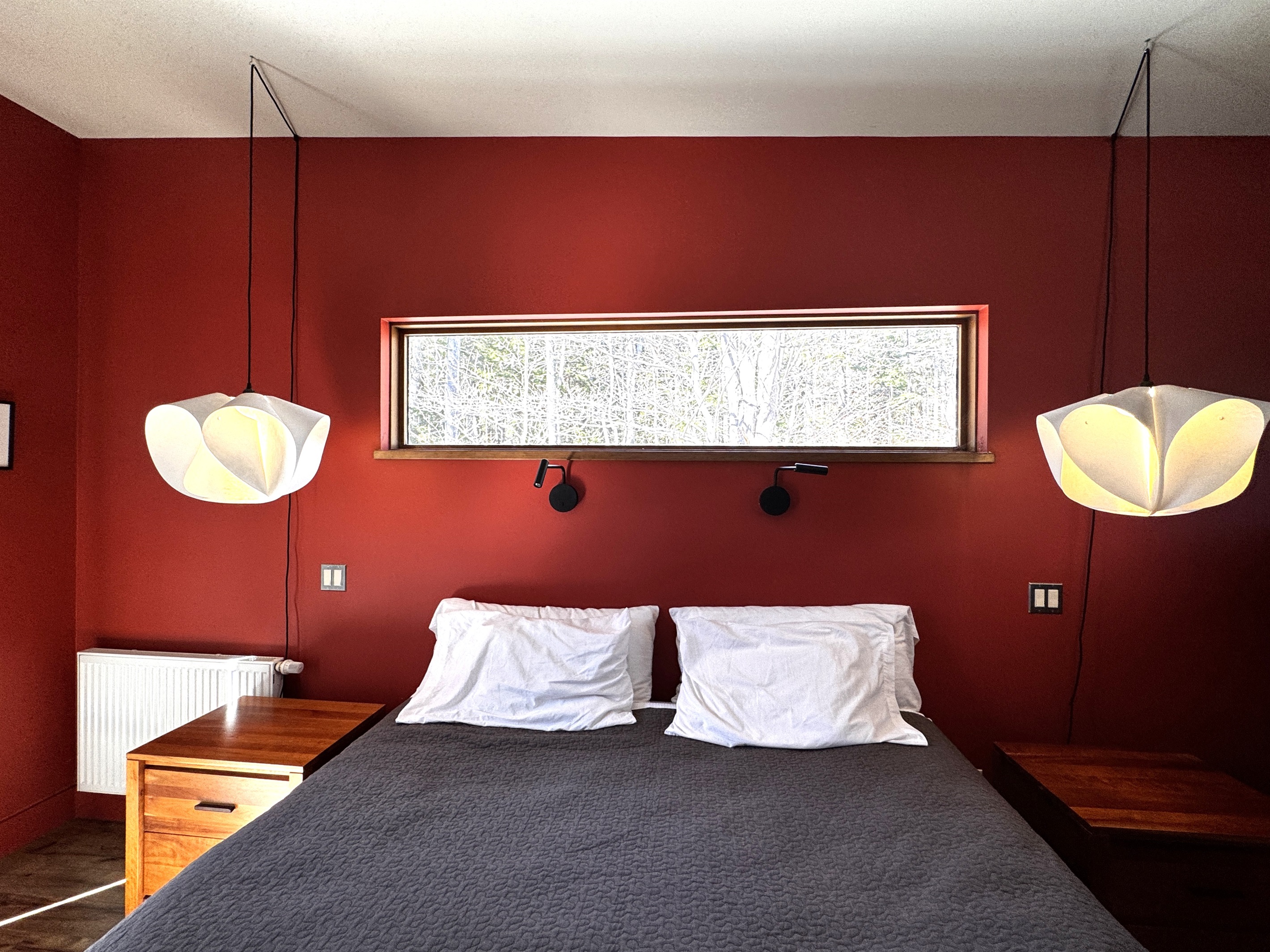 Wake up to nature with this unique forest-view clerestory window. Positioned perfectly above the King bed, this architectural detail provides complete privacy while framing the ever-changing colors of the Acadia woodlands just outside.