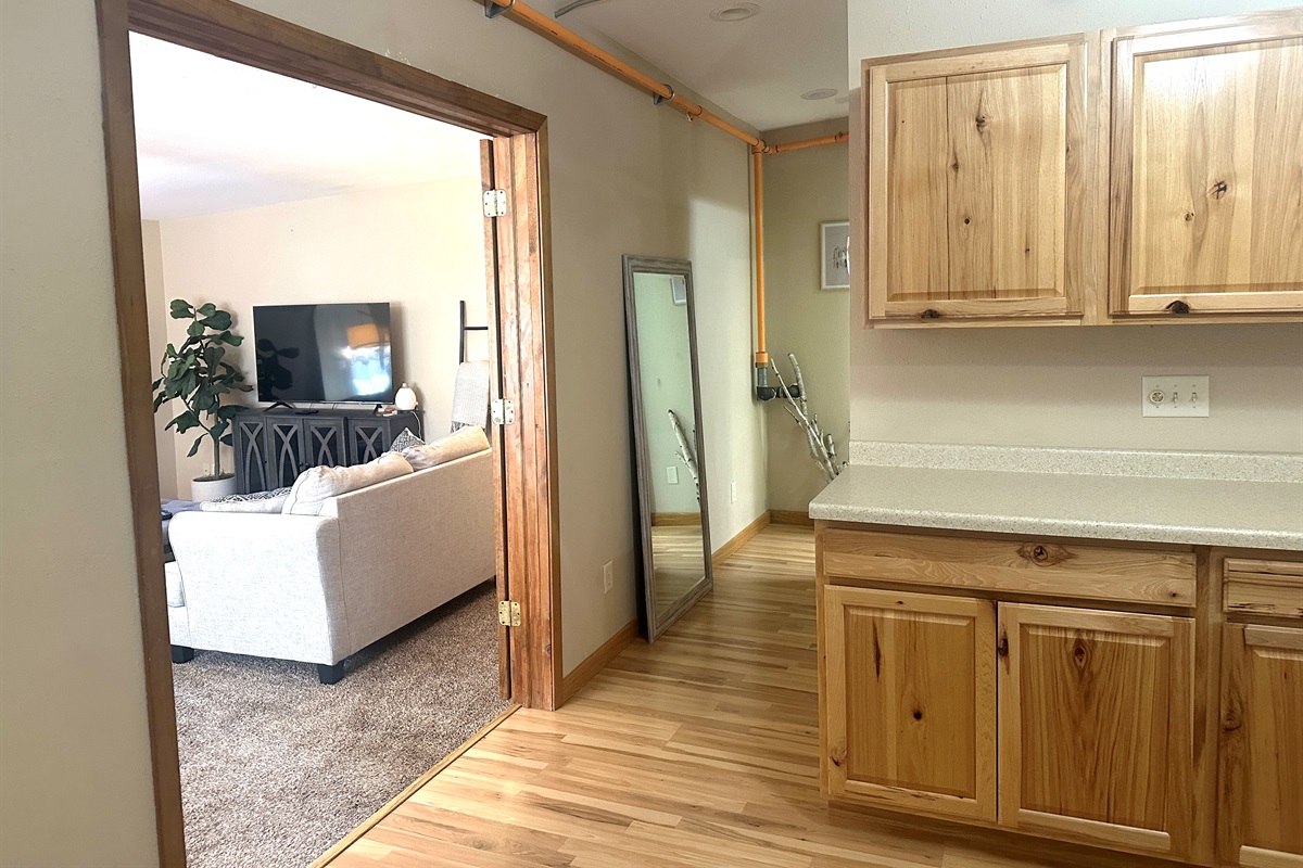 The bathroom is just down the hall from the kitchen and living room. 