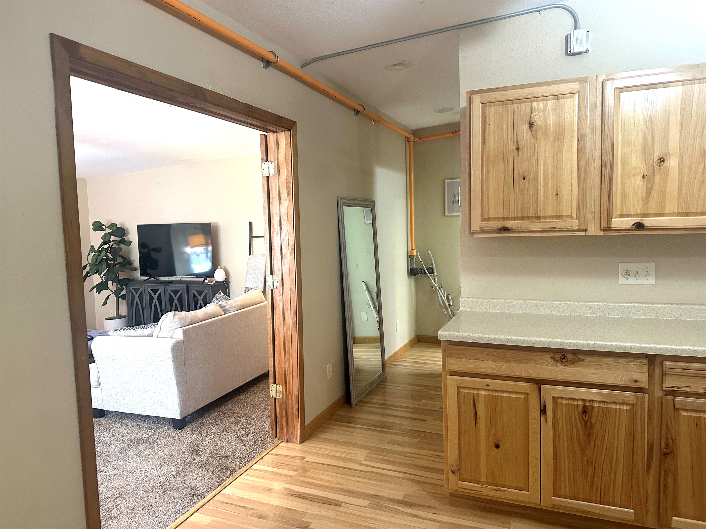 The bathroom is just down the hall from the kitchen and living room. 