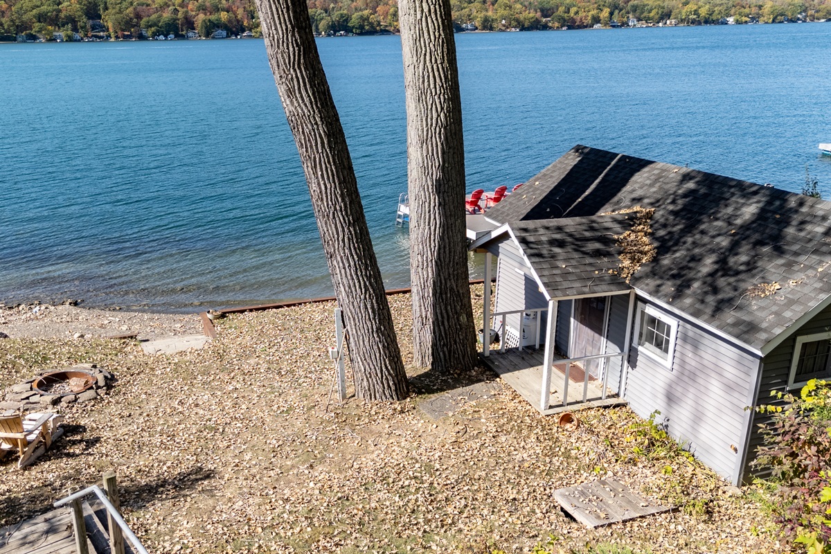 Private lake access with a cozy boathouse and pebble beach — your own slice of lakeside paradise.