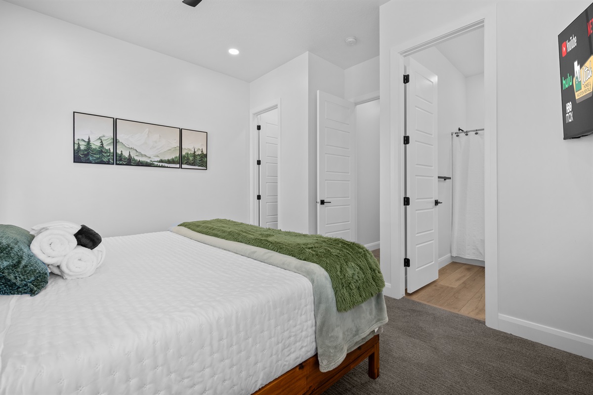 Stylish primary suite with contemporary furnishings and ensuite access.