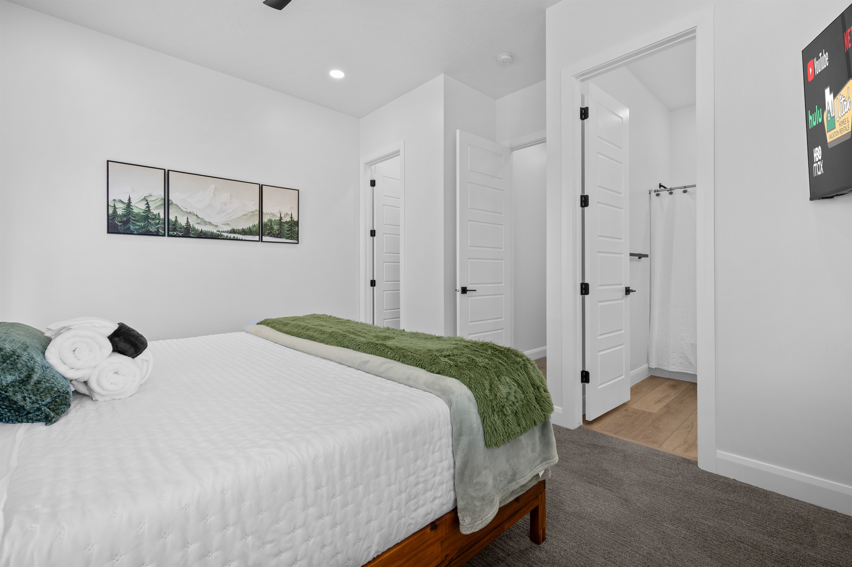 Stylish primary suite with contemporary furnishings and ensuite access.