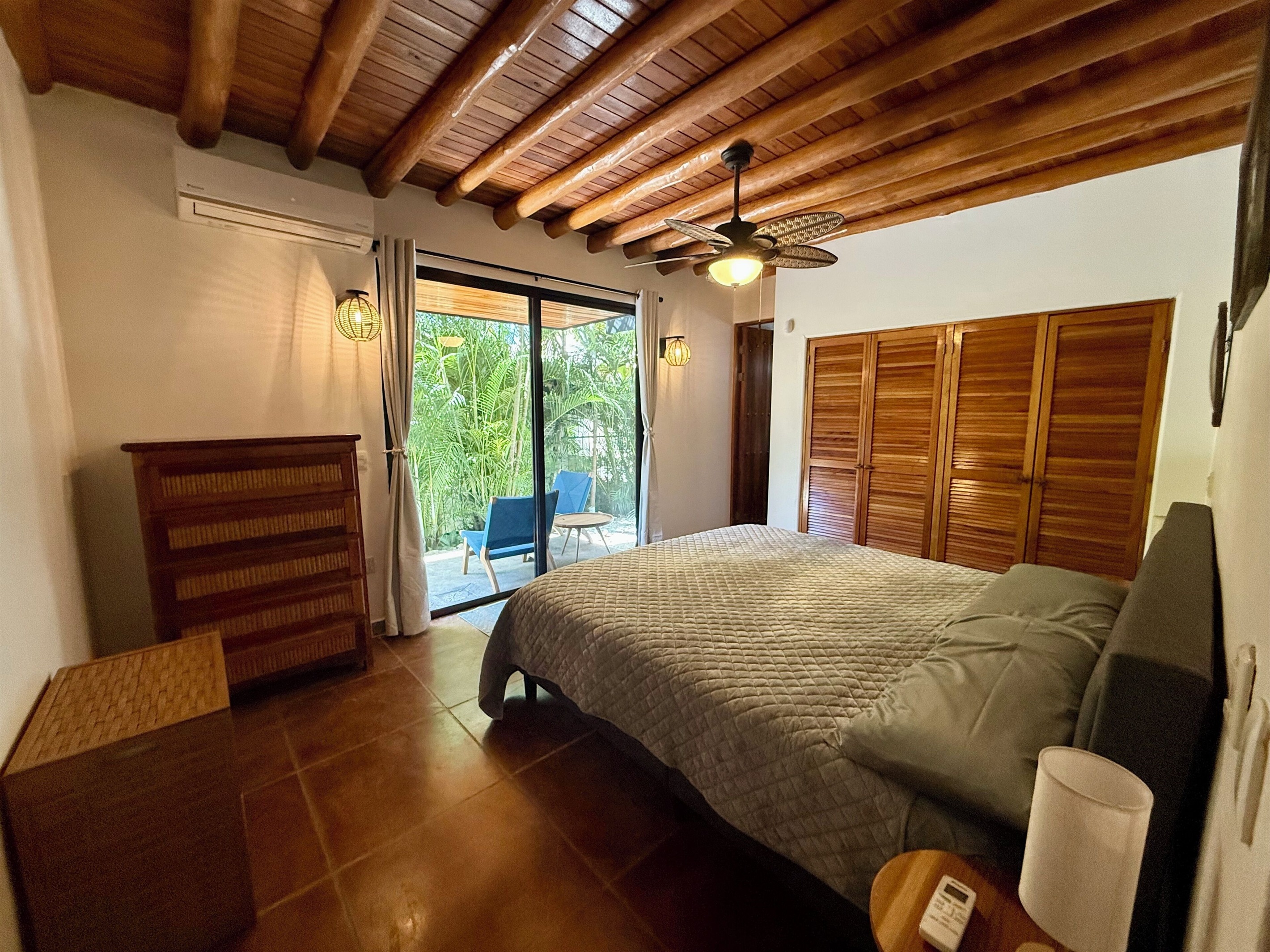 Bedroom 1- king bed with private patio