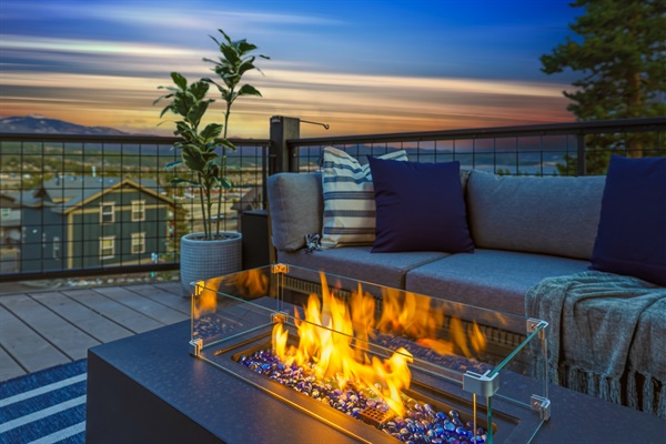 Cozy up by the fire table as the stars begin to appear overhead.