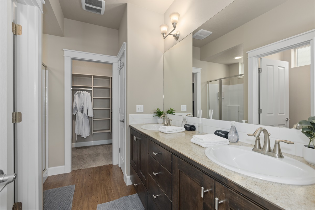 Double vanity and walk-in closet for extra comfort.