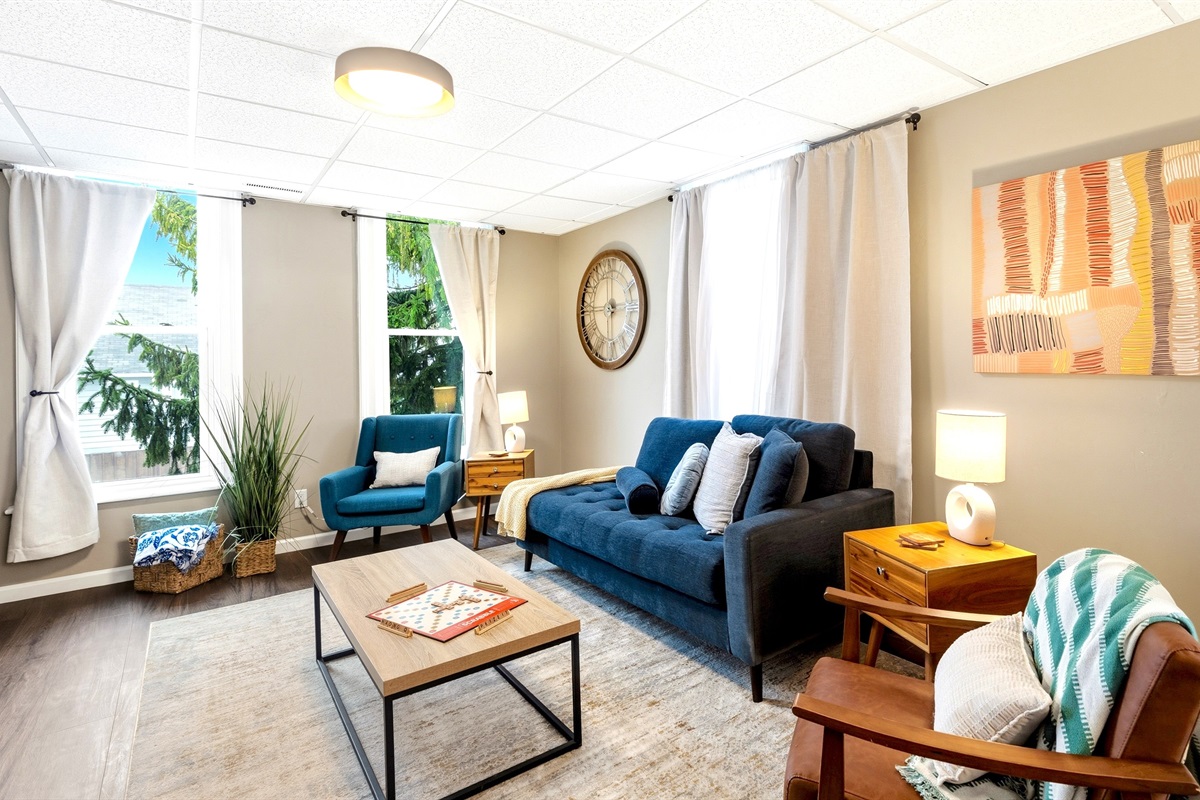 The open layout connects the living room, dining area, and play room so everyone can hang out together