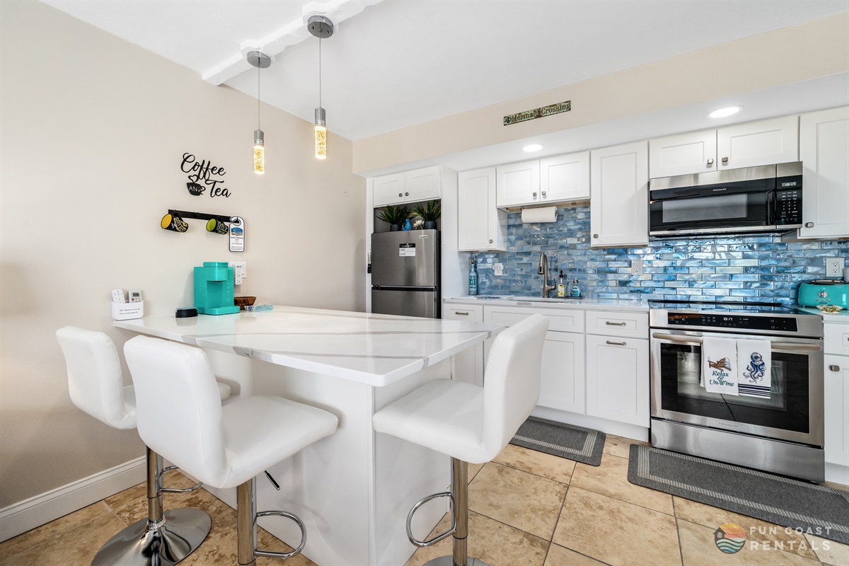 Modern Stainless Steel Kitchen with Island Dining Area