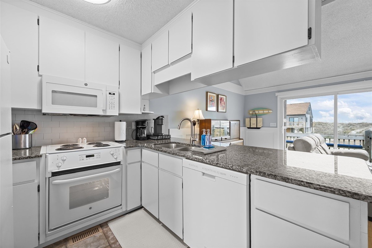 Bright, well-equipped kitchen with granite counters&mdash;easy meals, quick snacks, and everything within reach