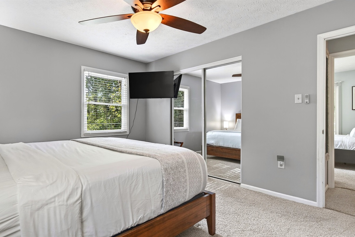 Main level master bedroom also features a TV.