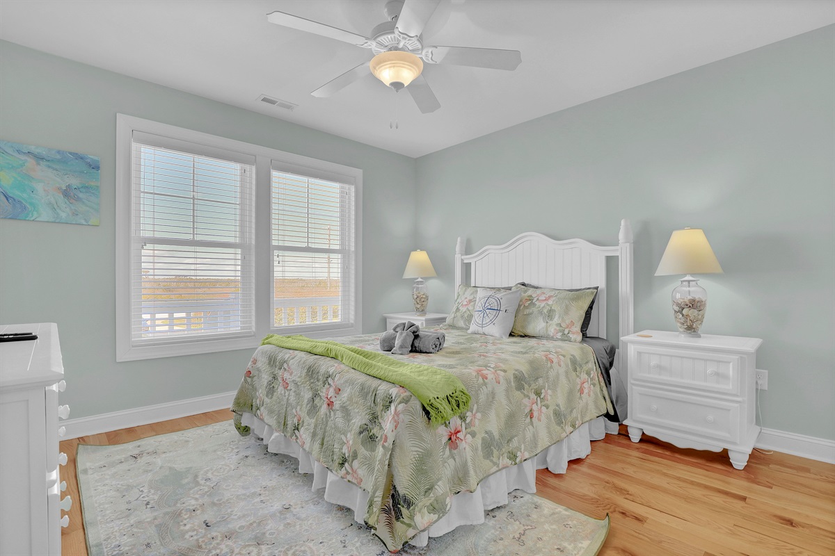 Airy queen bedroom with large windows to let in the North Carolina sunshine.