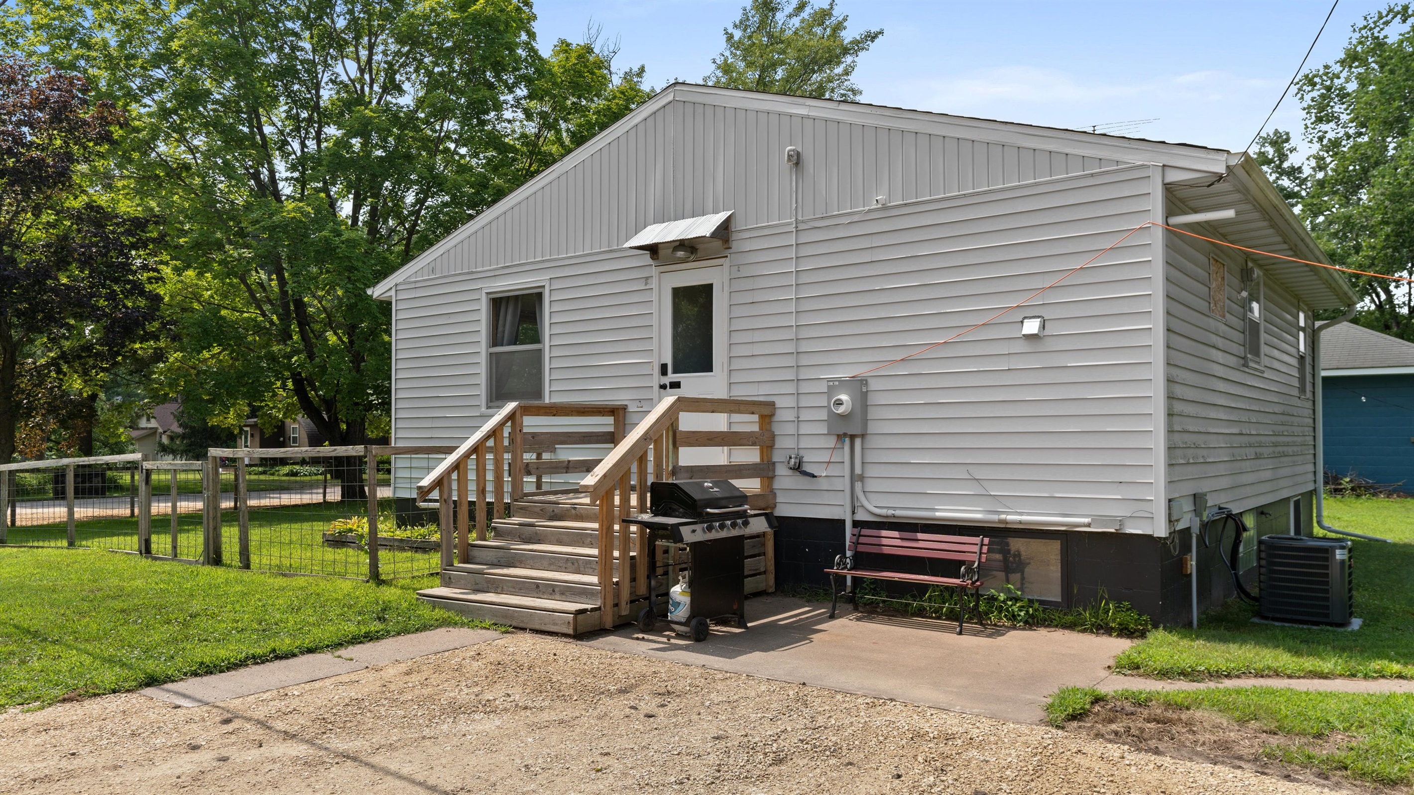 Enjoy the patio and grill area, with more seating around the backyard fire ring.