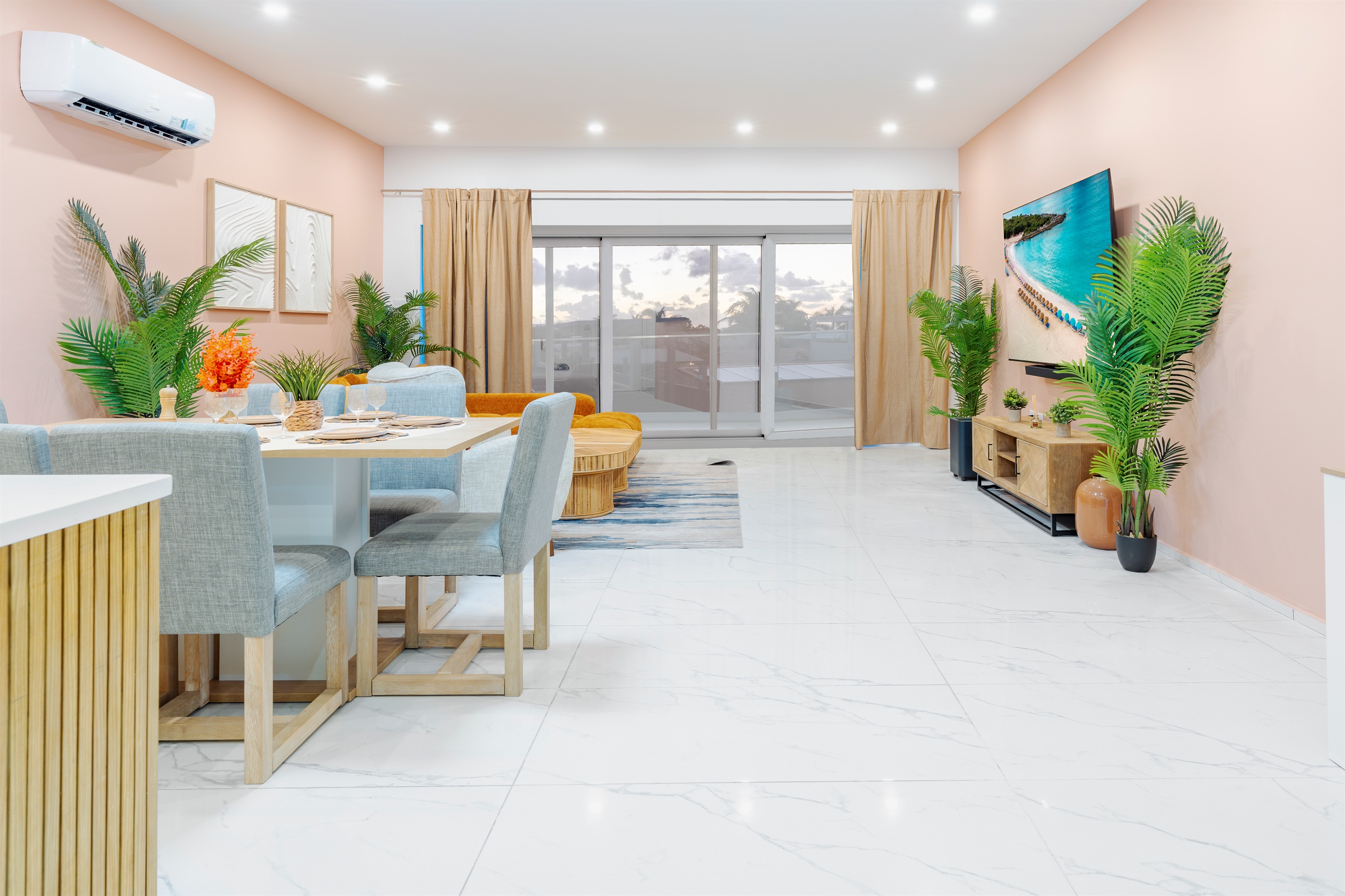 Bright Coastal Living Room with Wall-to-Wall Sliders