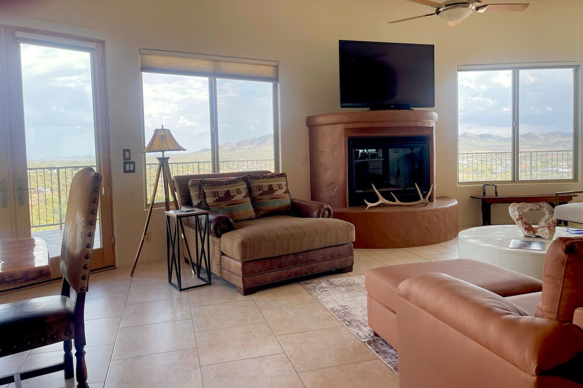 A cozy chaise by the fireplace gives you a comfortable spot for TV time or a quiet break.