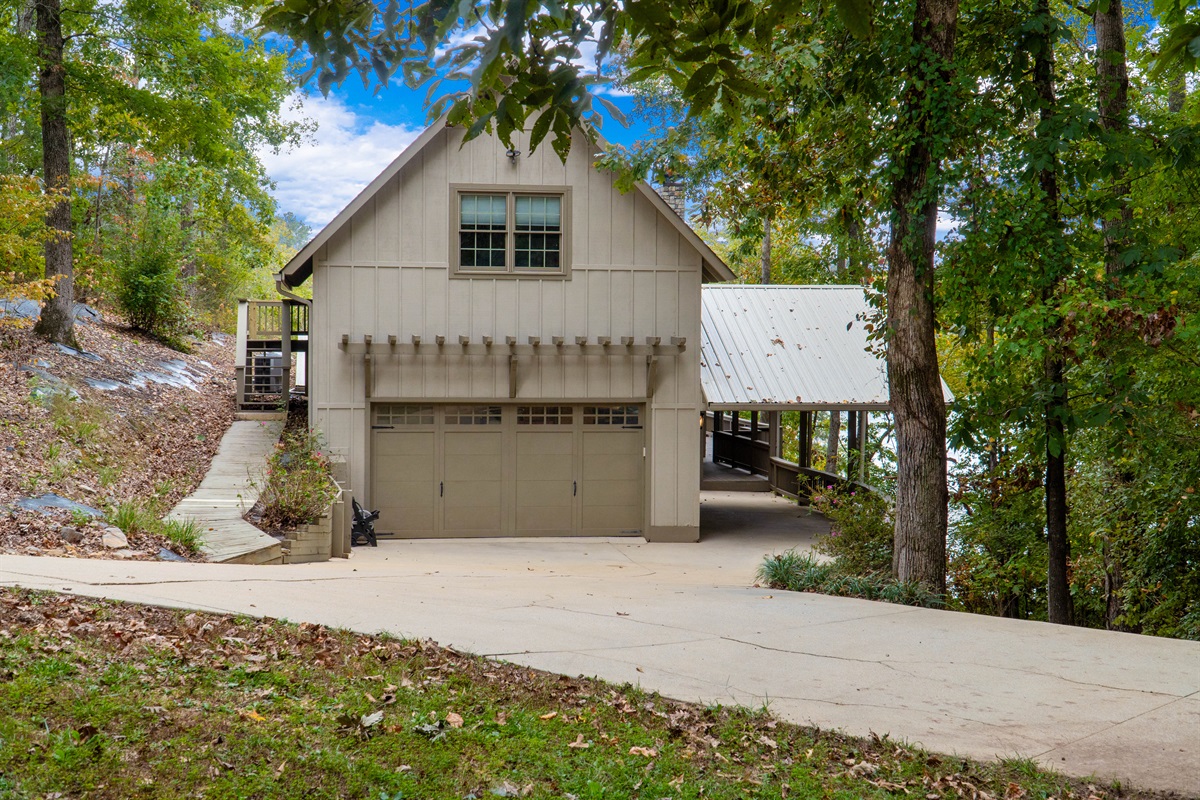 Enjoy a view of the front of the house and the driveway, with plenty of parking available for guests and boats.