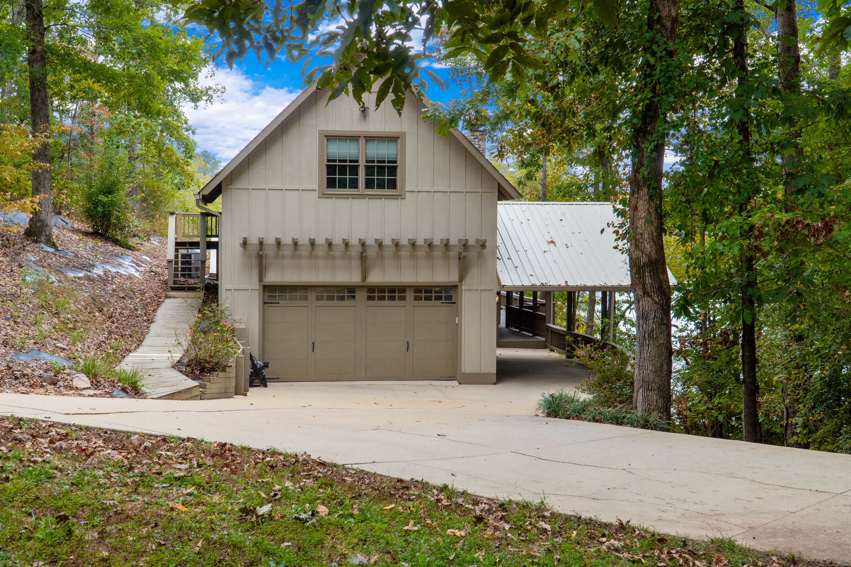 Enjoy a view of the front of the house and the driveway, with plenty of parking available for guests and boats.