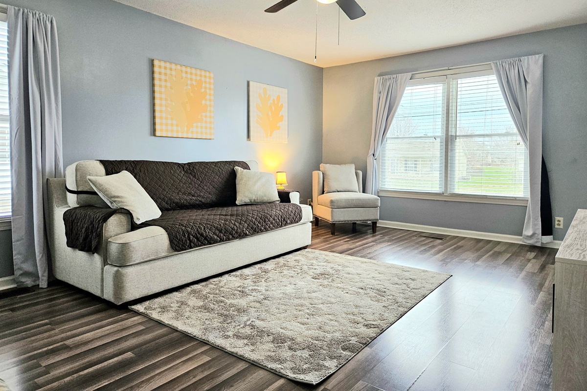 Spacious living room with elegant features and comfortable seating. High Speed WIFI, smart TV and keyless entry included
