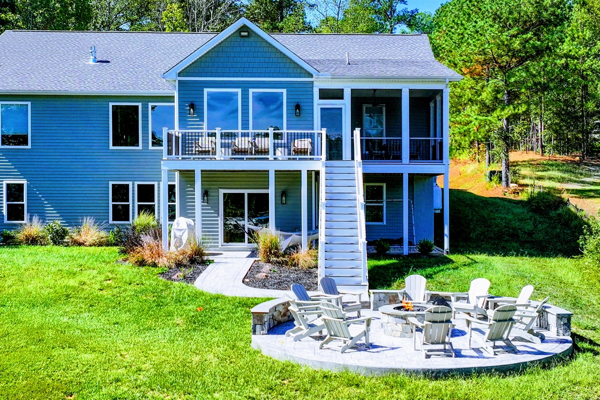 This stunning lake house offers the perfect blend of comfort and outdoor fun! Gather around the fire pit, relax on the spacious deck, or unwind in the screened porch—all with breathtaking views. Your dream lake getaway starts here!