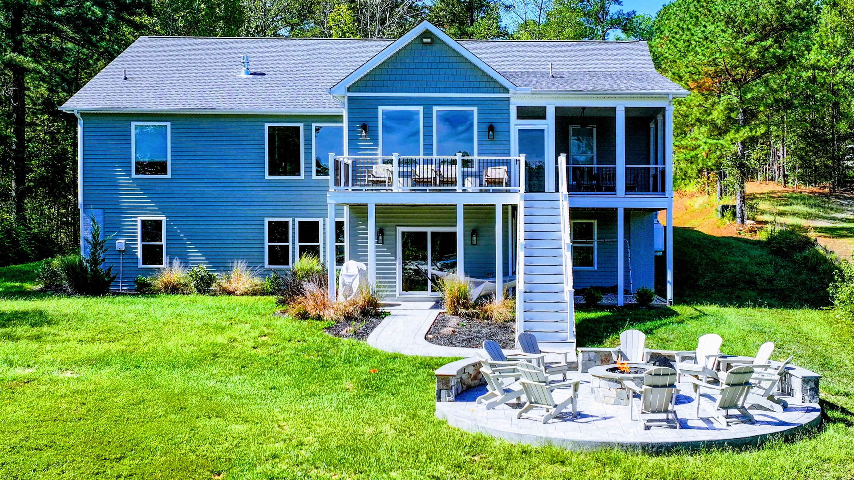 This stunning lake house offers the perfect blend of comfort and outdoor fun! Gather around the fire pit, relax on the spacious deck, or unwind in the screened porch—all with breathtaking views. Your dream lake getaway starts here!