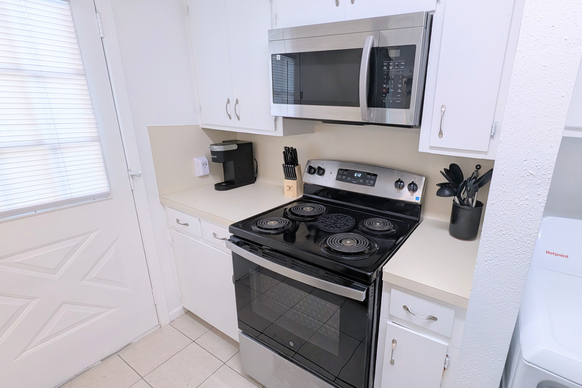 Equipped for all your cooking needs, the kitchen is fully stocked with dinnerware, pot & pans, baking pans, basic spices, and coffee bar. 